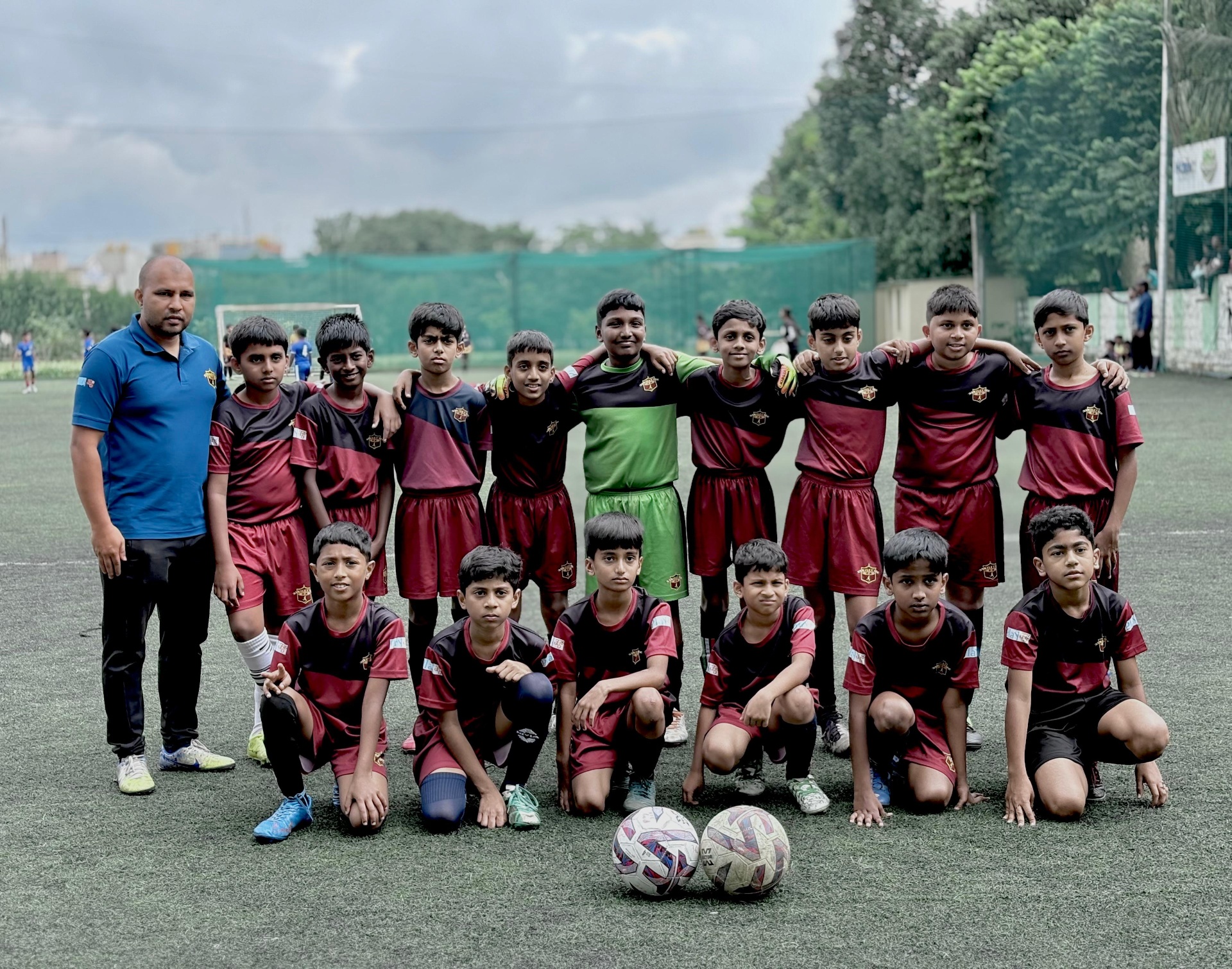 Titan FA U-13 squad portrait with coach